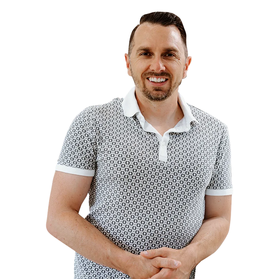 Daniel Keeton — smiling man with short dark hair and light beard, wearing a patterned polo shirt