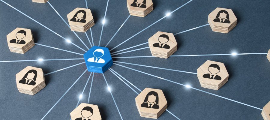 a close up of a blue linked icon surrounded by wooden blocks symbolizing lead communication
